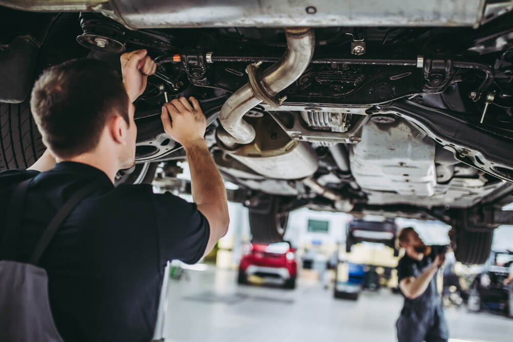 Mechanic repairing an exhaust